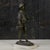 This charming bronze sculpture, depicting a young fisherman with baskets of fish and octopuses, evokes the authentic feel...