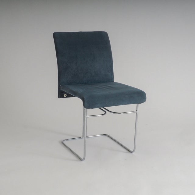 This set of four dining chairs, designed by Ernesto Radaelli for Saporiti, embodies the elegance of the mid-twentieth...