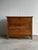 Solid oak chest featuring quarter sawn drawer fronts with pronounced grain, a wide plank top, and a shaped apron. Three...