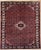 Hand-knotted rug from the Hamadan region of western Iran, featuring a small central medallion set within a densely...