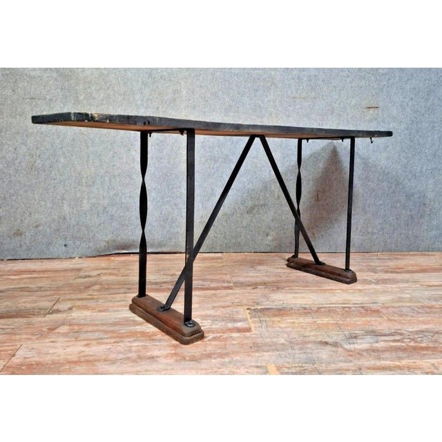 Stunning industrial-style console/table, full of character. the tabletop is made of reclaimed wood with a beautiful patina...