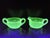 This early American pressed glass dolphin green sugar and creamer set was made by the Mckee Glass Co. from Jeannette P.A...