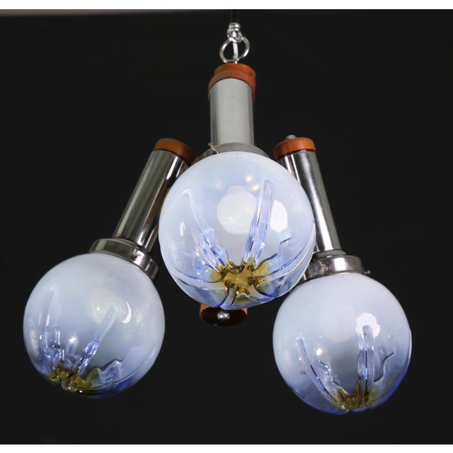 A striking and elegant mid-century chandelier crafted in Murano glass by the renowned Mazzega. This exceptional piece...