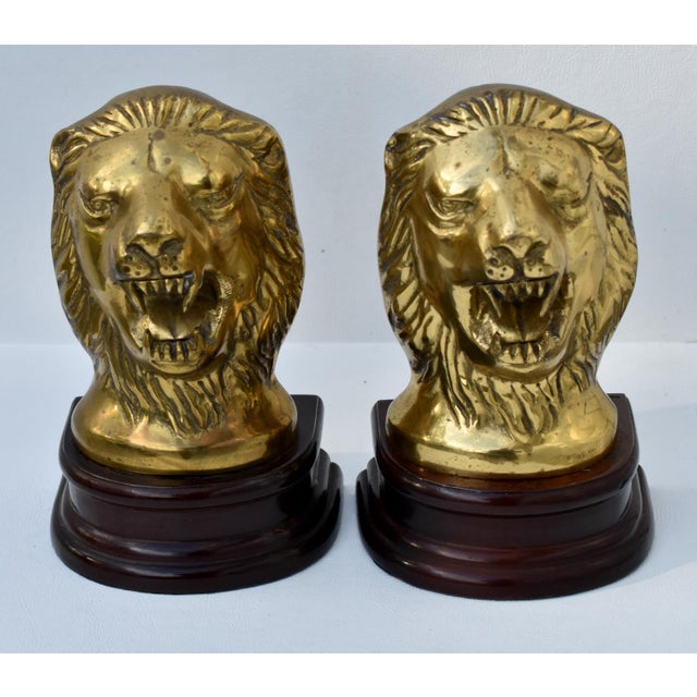 Vintage (1990's) Bookends have a Lion Head. Made of Brass with a Wood Base. The Measurements: 5"W x 3.5"D x 8"H. Flat Rate...
