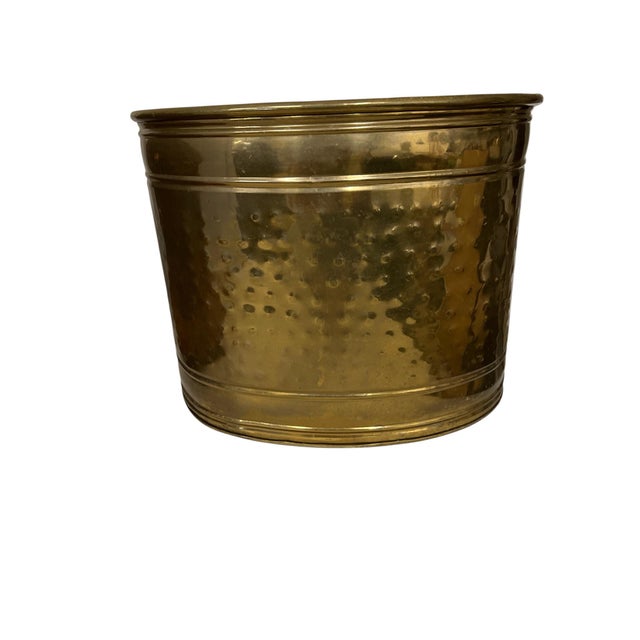 Vintage hammered brass with rope swag embellishment on front. Would make a great wastebasket, container or planter....