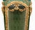 A spectacular pair of french vitrines in the louis xvi style, richly adorned with carved giltwood and striking faux...