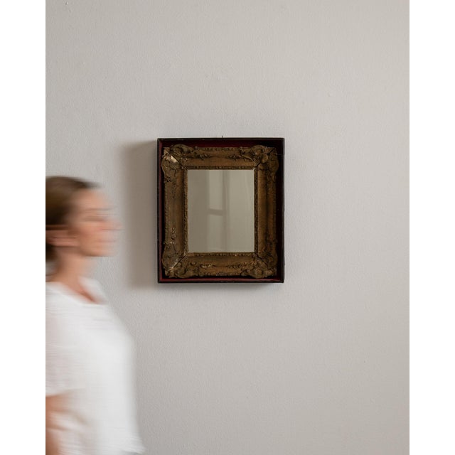 This piece presents as a mirror, distinguished by dark bronze/gold ornate carved frame. The piece dates to 19th Century,...