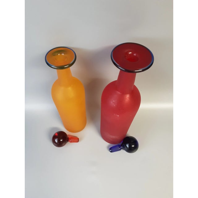 Vintage frosted blown glass decantors by Franco Moretti Murano Glass. One decantor is gold with red topper , and the other...