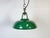 Industrial green enamel factory pendant light made in United Kingdom during the 1960s. White enamel inside the shade....