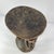 This finely carved Luba figural stool features two standing figures supporting the circular seat above, their hands...