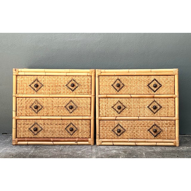 This exceptional pair of vintage chests embodies the breezy elegance of mid-century coastal design with a touch of...