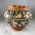 A thin walled and delicately decorated with an intricate geometric design Olla in the traditional style of the Acoma...