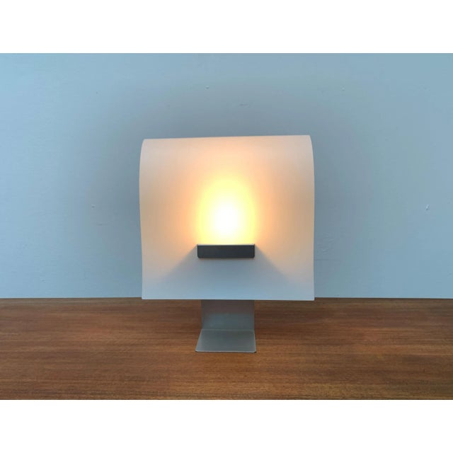 Minimalist table lamp based on a design by cristina lamiquiz from 1995. the design impresses with its minimalism and use...