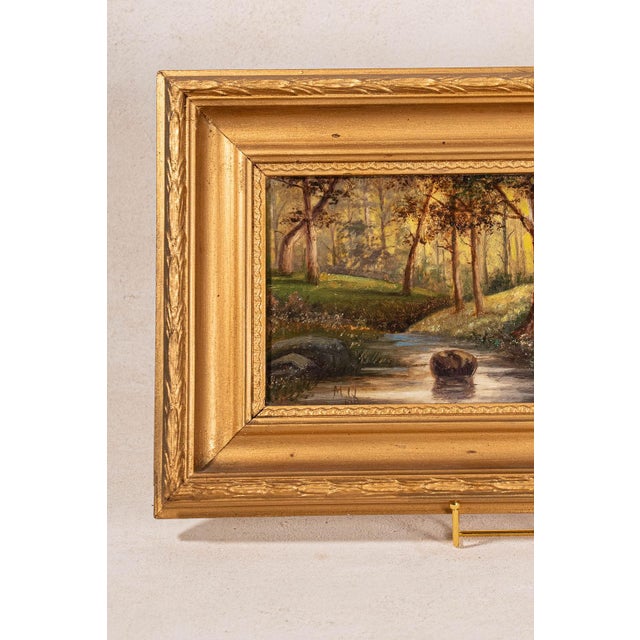 Signed original oil on canvas by British artist M. Quilter, dated 1914, titled Woodland Stream in Summer, depicting a...