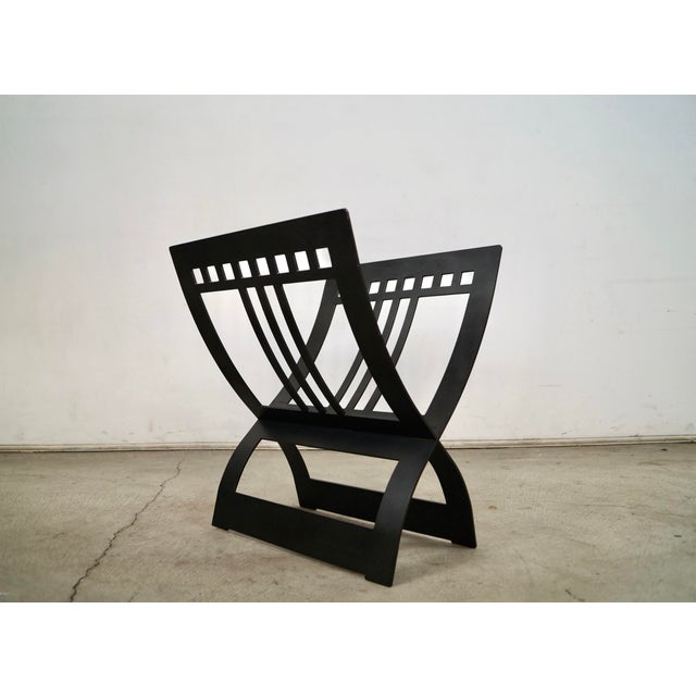 Solid metal wood log holder / magazine rack for sale. It has a cool Arts & Crafts design and aesthetic, and is really...