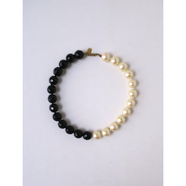 A chic black and white, collar length, faux-pearl and faux-black onyx bead necklace by designer, Miriam Haskell, circa...