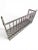 Reclaimed forged bronze balcony with woven bronze decking, square frame, and curled hanging hooks. It comes with bronze...