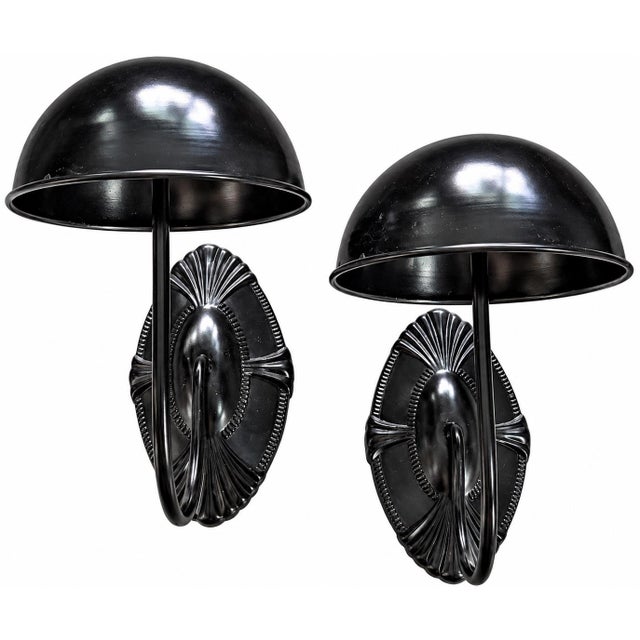 Striking pair of black metal wall-mounted hat and coat hooks with a sculptural Art Deco-inspired design. Each piece...
