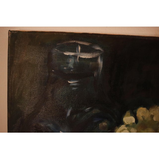 This evocative oil on canvas painting captures a classic still life composition with a rich, dark palette. The work is...