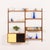 This teak wall unit with an expository shelf was designed by poul cadovius for cado in the 1960s. Its simple form provides...