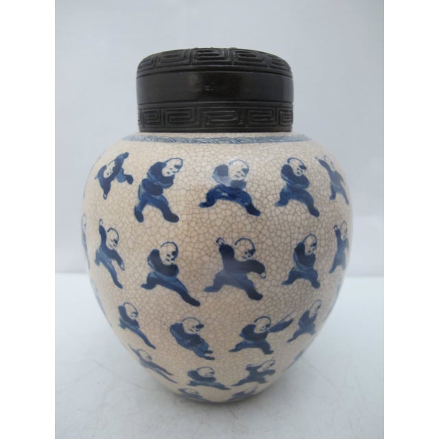 Antique Chinese porcelain snuff bottle or small ginger jar. Porcelain with crackle glaze showing 100 Boys design in blue...