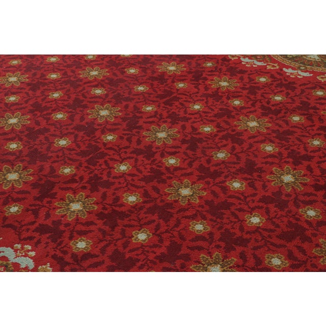 This 11x15 antique rug is a Donegal design—hand-knotted in wool, believed to originate from Ireland circa 1910-1920. It’s...