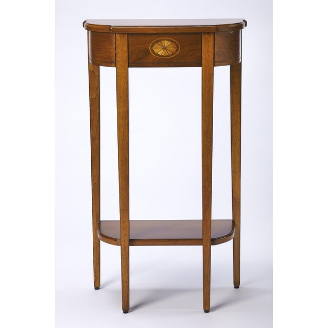 A spot of elegance for a small space, this Console tableâ€™s harmonious design begins with the slender legs, gracefully...