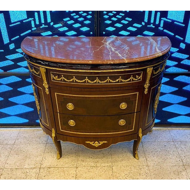 Magnificent French marquetry commode Louis XV style. Stunning French commode. Has a beautiful gold details. This piece is...