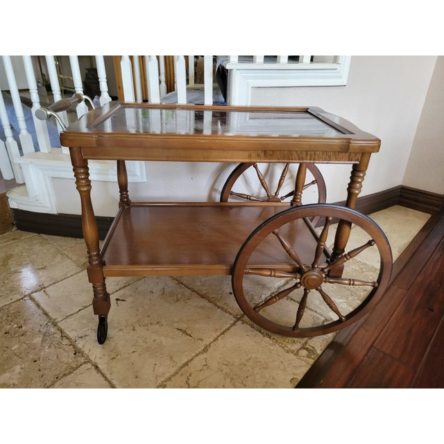 Beautiful rare find, two tier design, unbranded tea/bar cart with large front spoked wheels, rear casters, turned legs,...