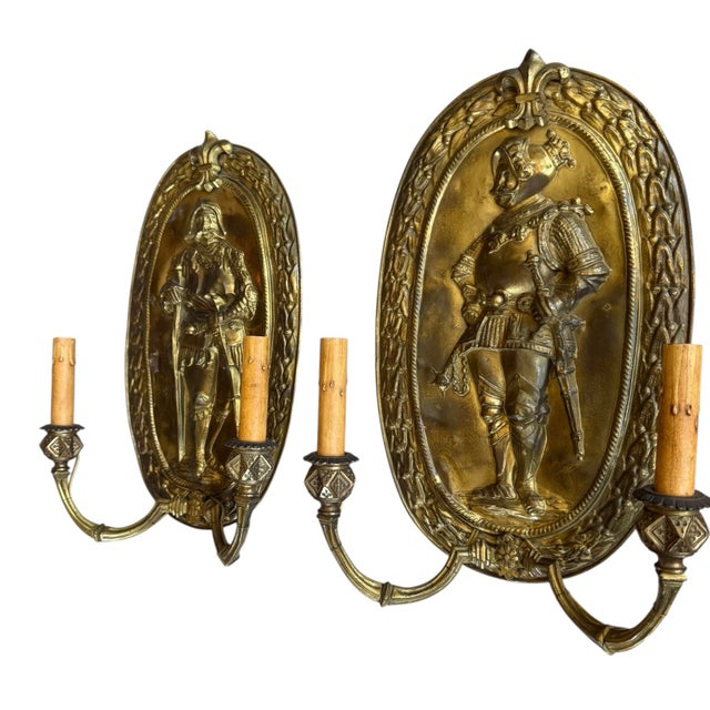 Super rare large antique brass Medieval Revival wall sconces featuring embossed figures of knights in full armor. These...