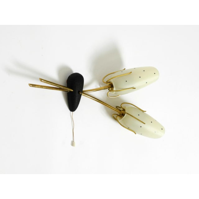A very rare mid-century modern wall lamp featuring brass construction and painted glass shades. a beautiful design,...