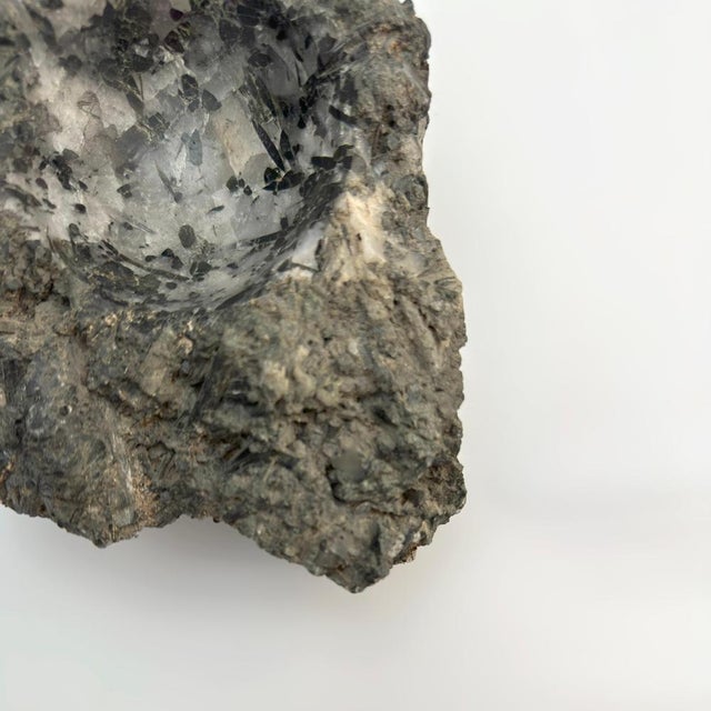 Hand-carved from a single piece of tourmaline quartz, this sculptural bowl merges organic mineral formation with refined...