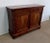 Mahogany sideboard designed in the early nineteenth century, consisting of a wooden top in mahogany burl veneer with a...