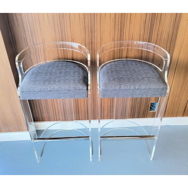 Elevate your space with this stunning pair of 1970s Post Modern Lucite bar stools, crafted by Hill Manufacturing Co., NY....