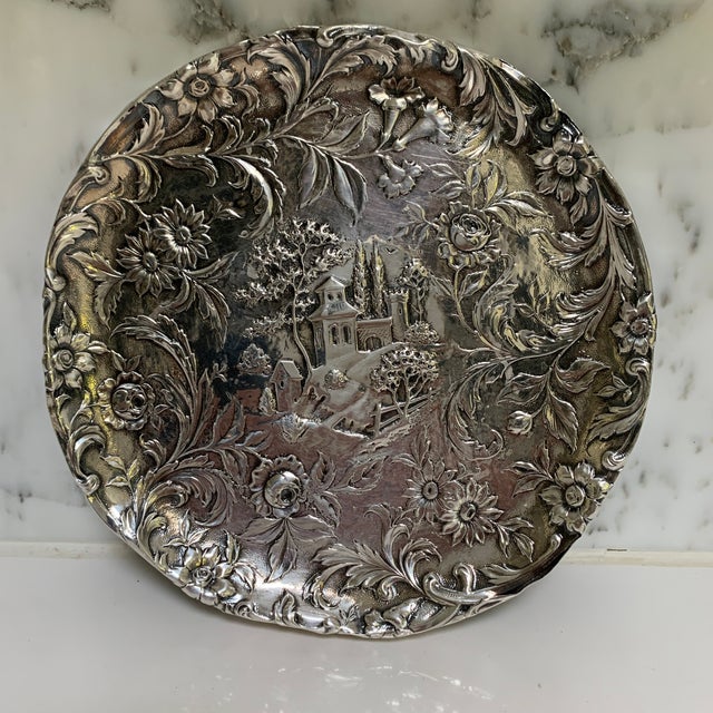 Beautifully embossed in the charming Castle pattern, this sterling silver teapot stand or trivet is signed “Kirk & Son Co...