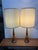 Design Plus Gallery presents a Pair of Walnut Table Lamps from the Mid 20th Century. They are both very tall with shaped...