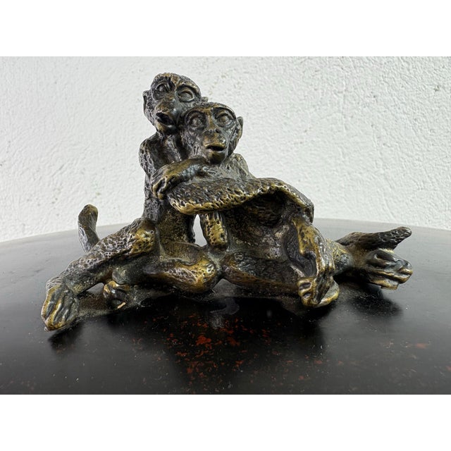 This is a large oval dresser box with a bronze sculpted monkey handle. This box has a dark faux tortoise shell finished to...