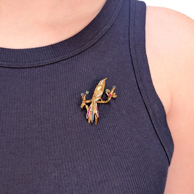 A fine signed vintage gold and multi-gemstone figural brooch. By Rudi Cherny of the Australian jewelry company 'Altmann +...