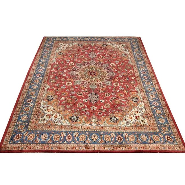 ACTUAL SIZE: 9’10” x 12’8″ PRIMARY COLOR: Rust / Blue AGE: Old MATERIALS: Wool FOUNDATION: Cotton PRODUCTION: Handwoven,...