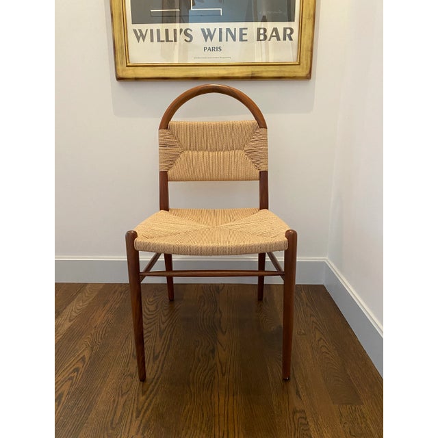 Simplicity at it's best. The Lemieux et Cie "Pernelle" side chair. The frame has a walnut finish and the seat & back are a...