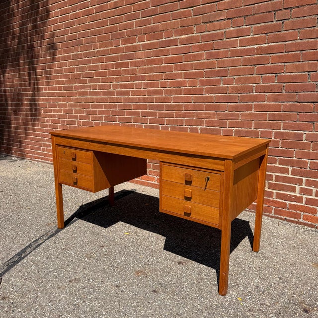 Crafted by Domino Møbler, this Danish modern teak desk combines clean Scandinavian design with exceptional everyday...