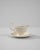 A vintage porcelain sauce boat made in Belgium, circa 1900. White china is finished with a luscious glossy glaze,...