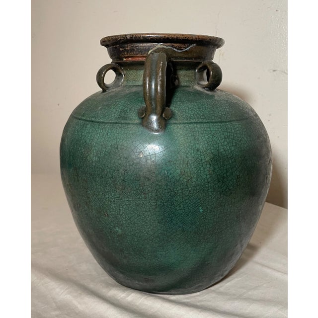 Up for sale is a rare antique handmade original Ming Dynasty Chinese glazed pottery wine jug. It's made with a gorgeous...