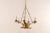 A French mid-20th century six-light chandelier. This French chandelier has a modern design featuring a small circular...
