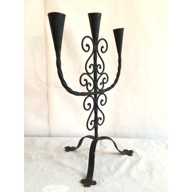 1950 Hand wrought iron candle holder - tripod base and scroll work add a nice presence for any interior setting.