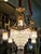 Illuminate your space with extraordinary elegance through this grand French Empire-style crystal chandelier, a...