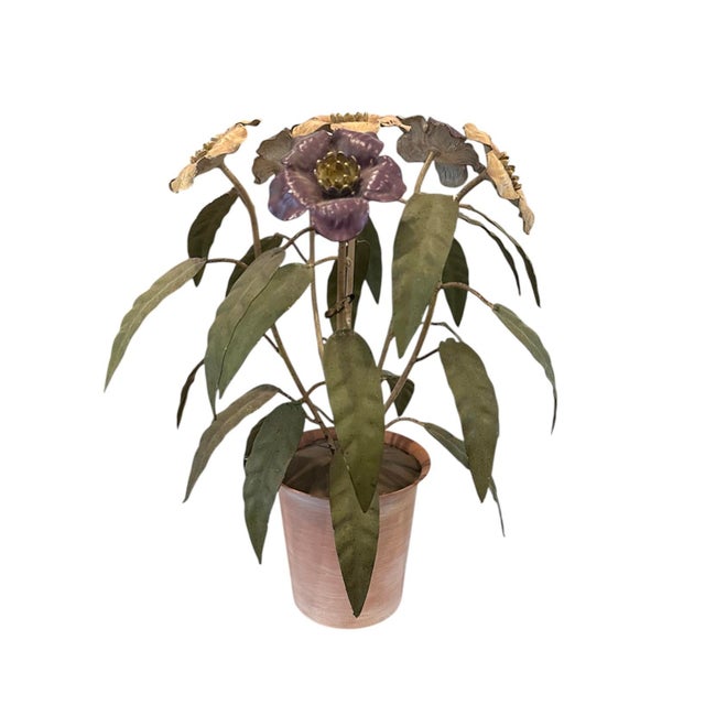 A charming, vintage tole potted floral arrangement. Features tole metal violets in shades of purple as nd peachy pink...