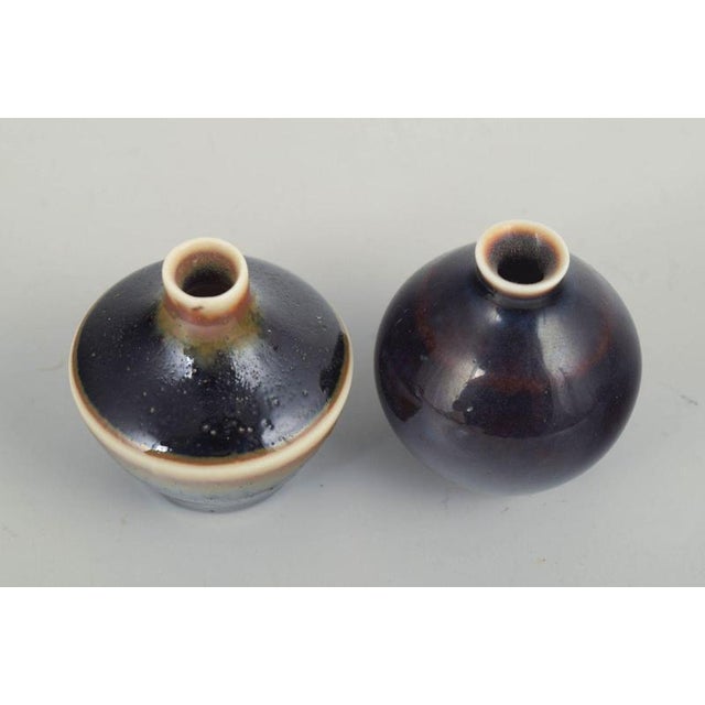 Carl-Harry Stålhane for Rörstrand Two Miniature Vases, mid 20th century. Two wheel-thrown stoneware miniature vases with...