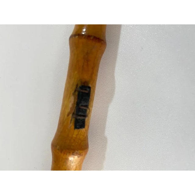 Listed is a fabulous, 1960s Italian faux-bamboo shoehorn/backscratcher. The piece has a beautiful, 'burnt' bamboo look to...