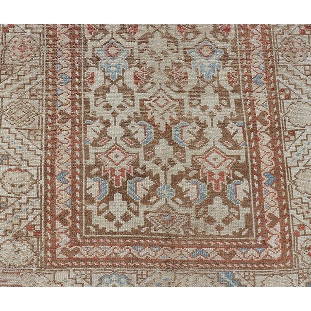 Antique Kurdish runner in soft tones in wool with all-over tribal design. Rug/R20-0708, country of origin / type: Iran /...